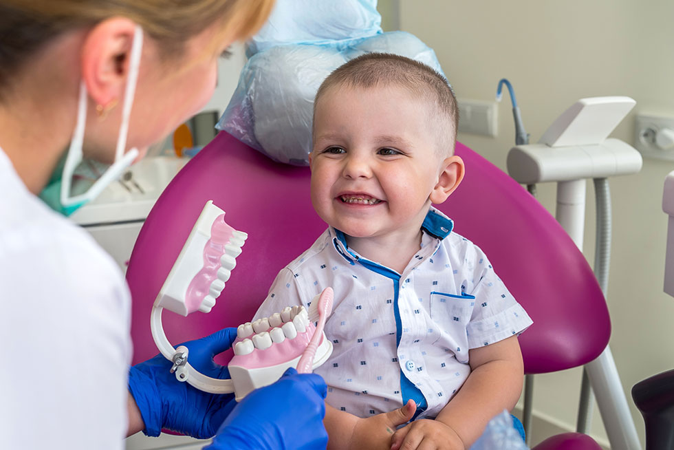 Toddler smiling at dentist